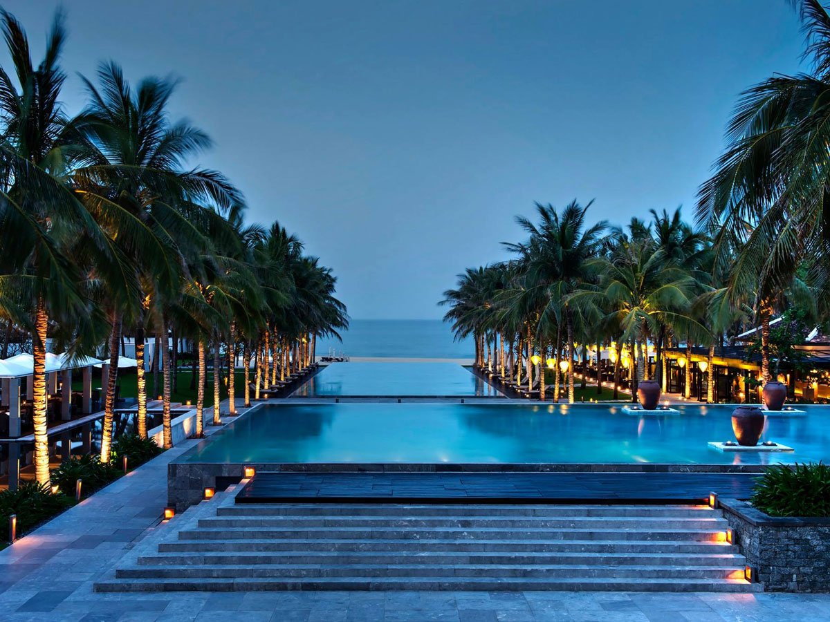 at-the-nam-hai-in-vietnam-youll-hardly-have-to-choose-between-the-pool-and-the-beach-considering-the-extravagant-pool-leads-right-to-the-sand