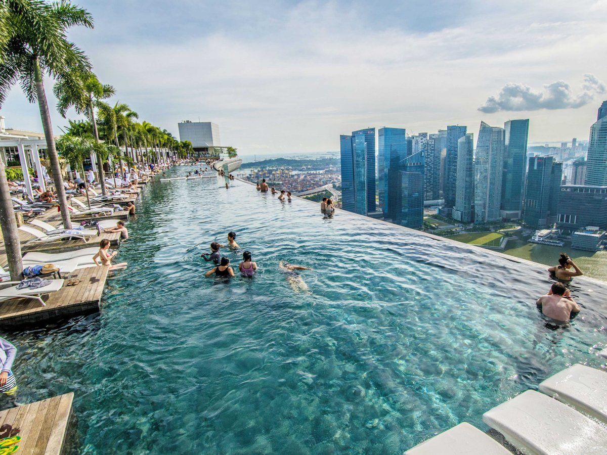 the-marina-bay-sands-hotel-in-singapore-has-a-stunning-infinity-rooftop-pool-on-the-hotels-57th-floor-where-guests-can-swim-and-admire-the-singaporean-skyline