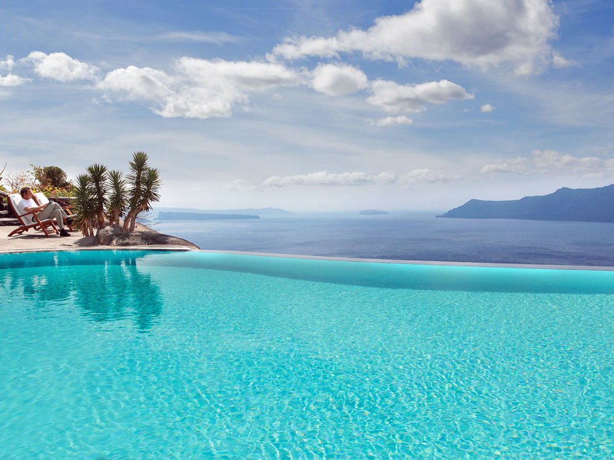 the-perivolas-hotel-in-greece-has-the-ultimate-infinity-pool-with-blue-water-that-seems-to-spill-out-right-into-the-mediterranean