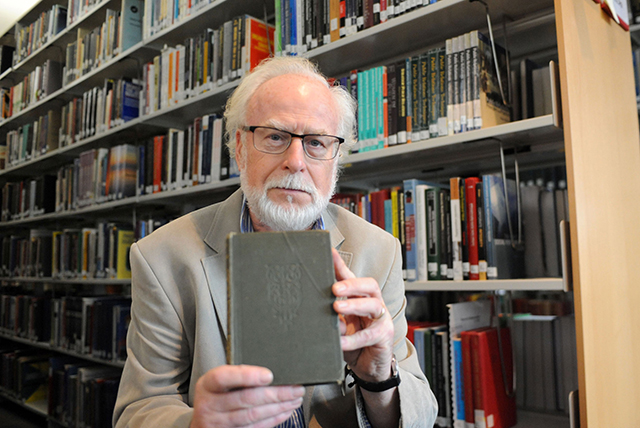 Alan Lewis - PhotopressBelfast.co.uk 13-9-2013 Prof John 'Jack' Foster of Queens University Belfast has just returned this library book that was forty-seven, (47), years overdue. The book , called 'Poems of Clough', was last stamped out of the library in 1966 and had to be physically handed in as it had no bar code necessary for the automated returns procedure now in place at the university's McClay Library.